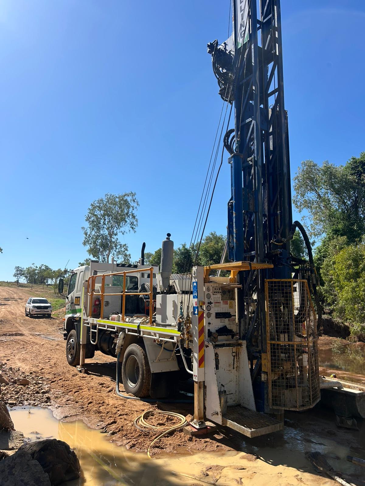 Rees Drilling compact rig working near trees