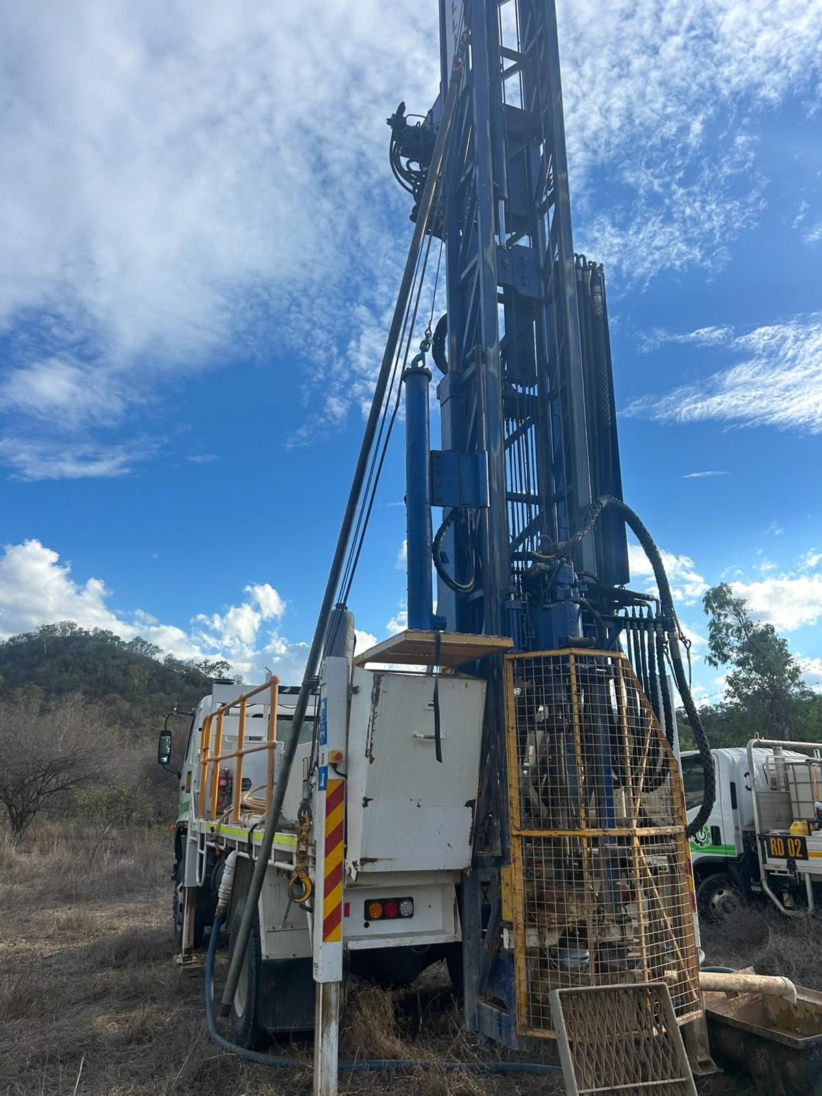 Rees Drilling compact rig working near trees