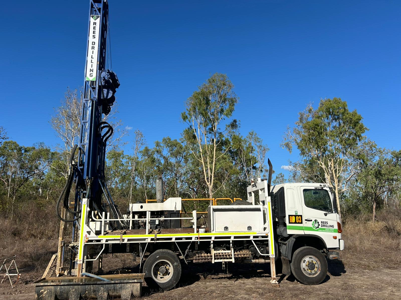 Rees Drilling compact rig working near trees